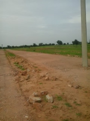 90A APPROVED (proposed) RESIDENTIAL PLOT ON ROAD IN MANDHA RIOCC ZONE