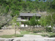 5000 sq.m. land with cottage, boundary, orchard, retaining walls, park